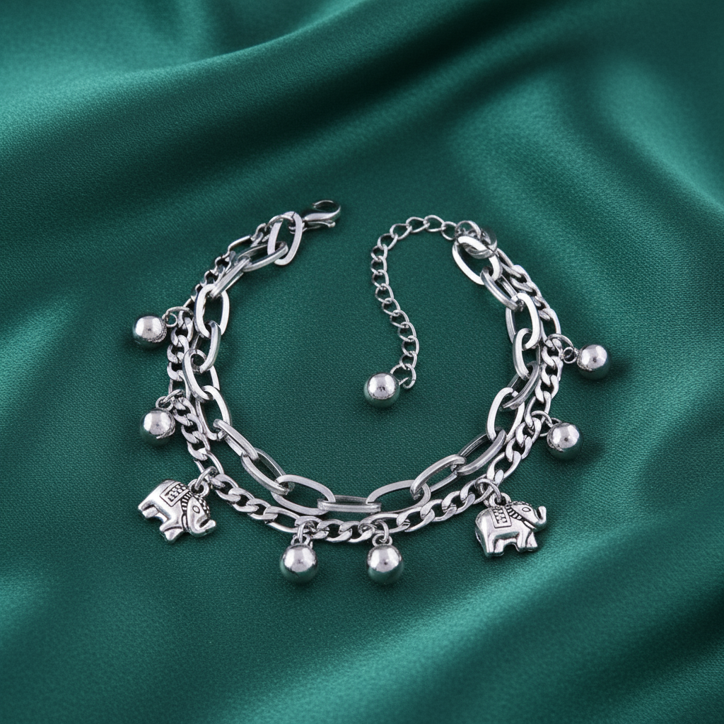 Elephant charm bracelet on emerald green satin