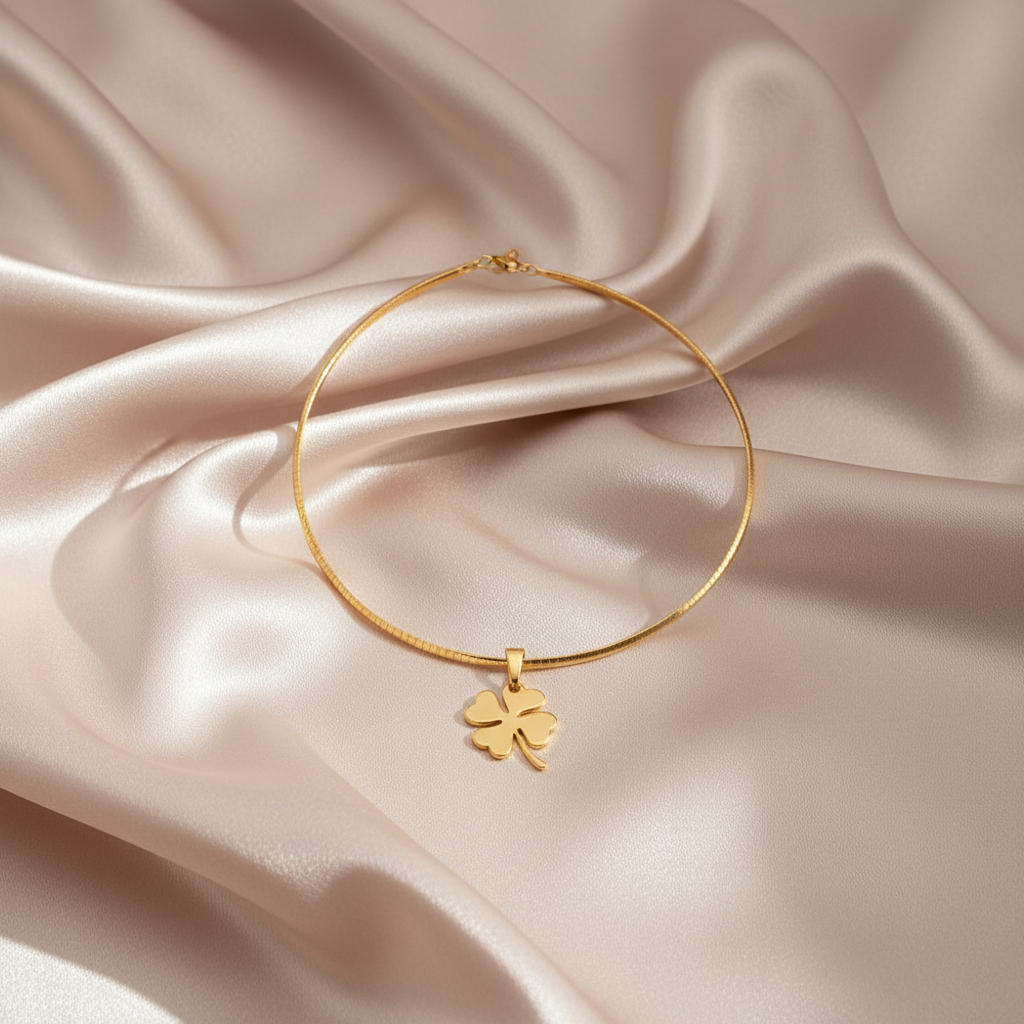 Gold Clover Necklace on Satin Background