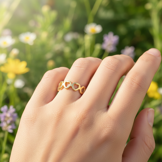 Gold heart ring with nature background