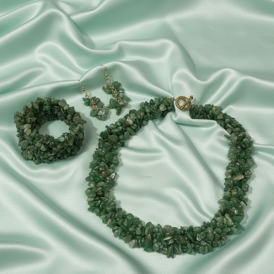 Green aventurine jewelry set on pastel mint green satin background