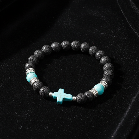 Pulsera lava con cruz turquesa sobre terciopelo negro