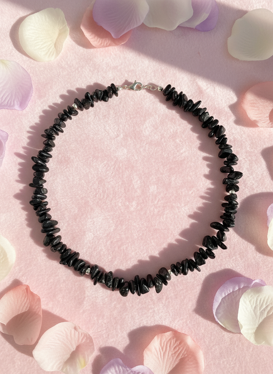 Black agate necklace on cute background