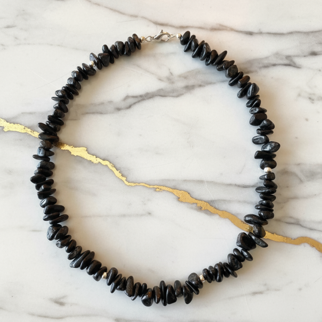 Black agate necklace on elegant marble background