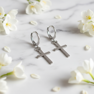 Cross hoop earrings on marble
