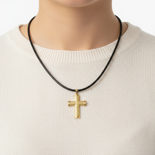 Female torso wearing gold cross necklace