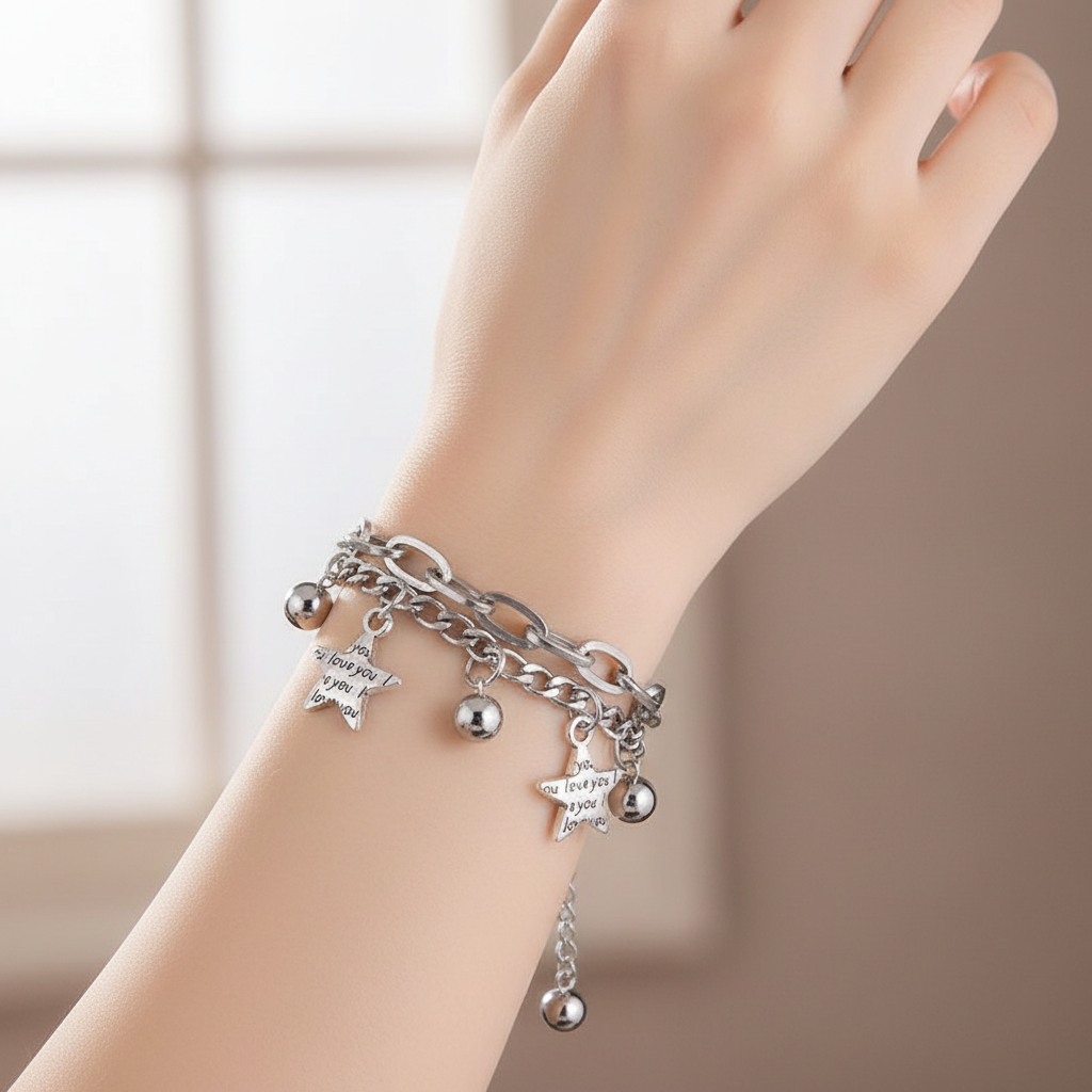 Model wearing layered chain bracelet