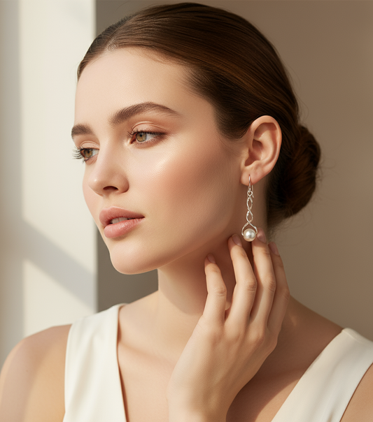 Model wearing pearl earrings