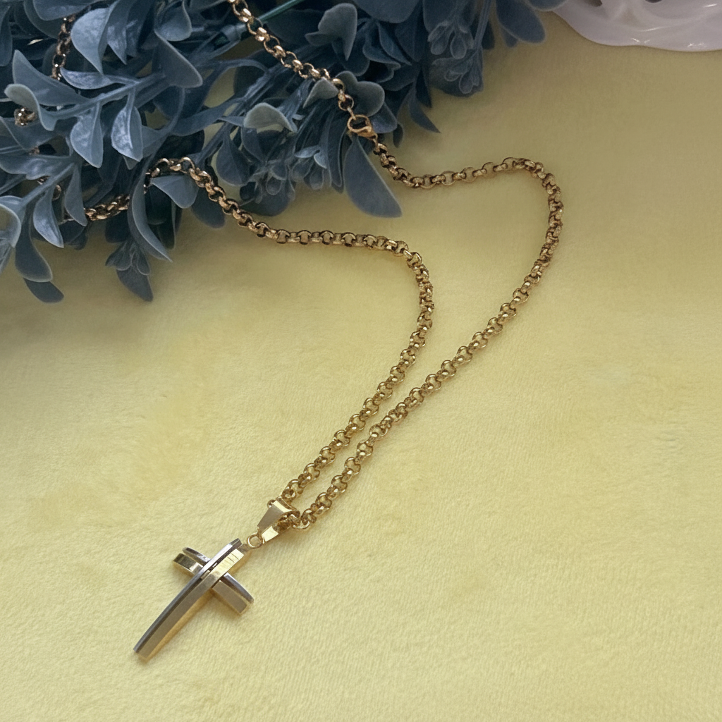 Two-tone cross necklace natural flat lay