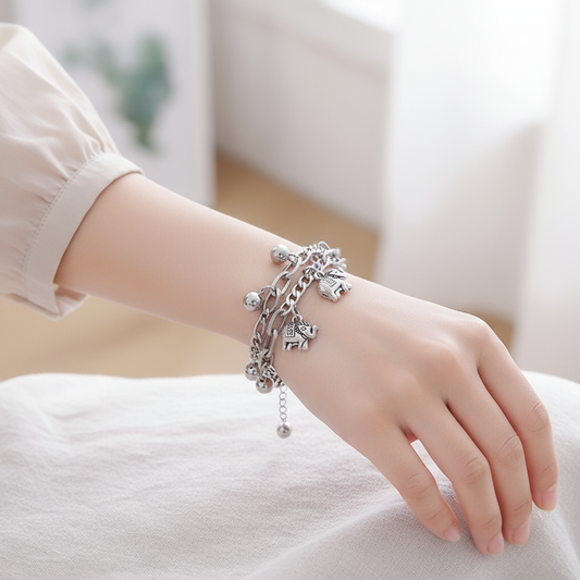 Woman wearing elephant charm bracelet